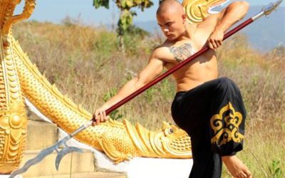 Shaolin kung fu student with bladed staff