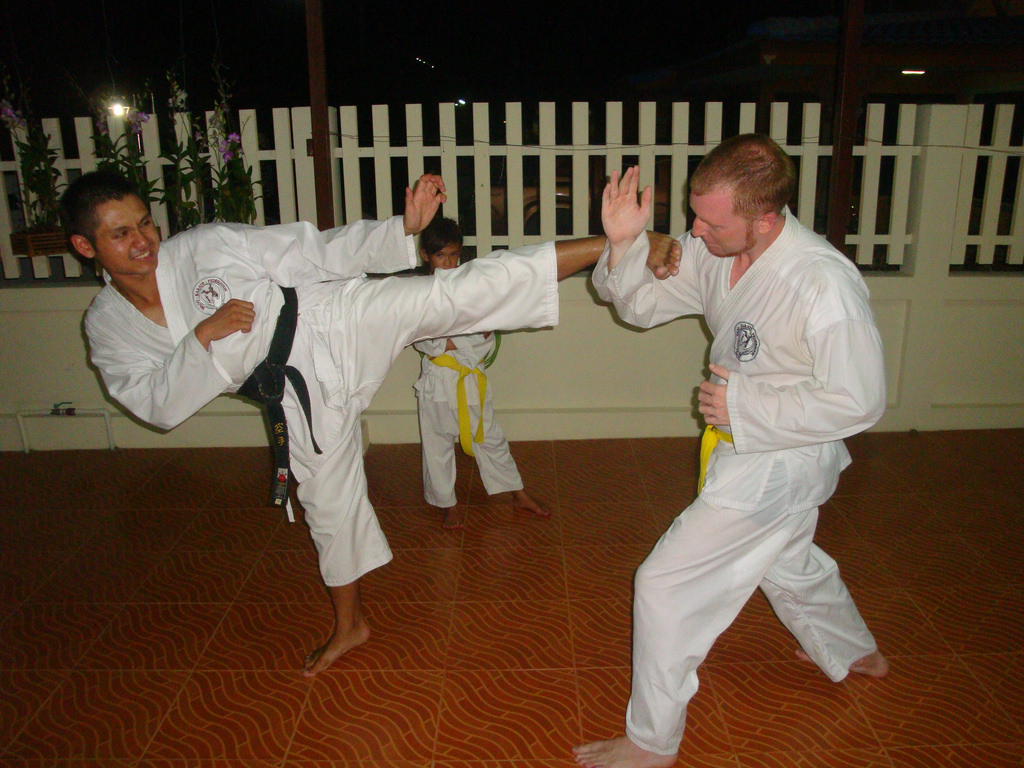 Wado Karate Federation Hua Hin training class student blocking kick fron John Oliver