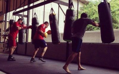 group training with heavy bag at Lion's head boxing gym