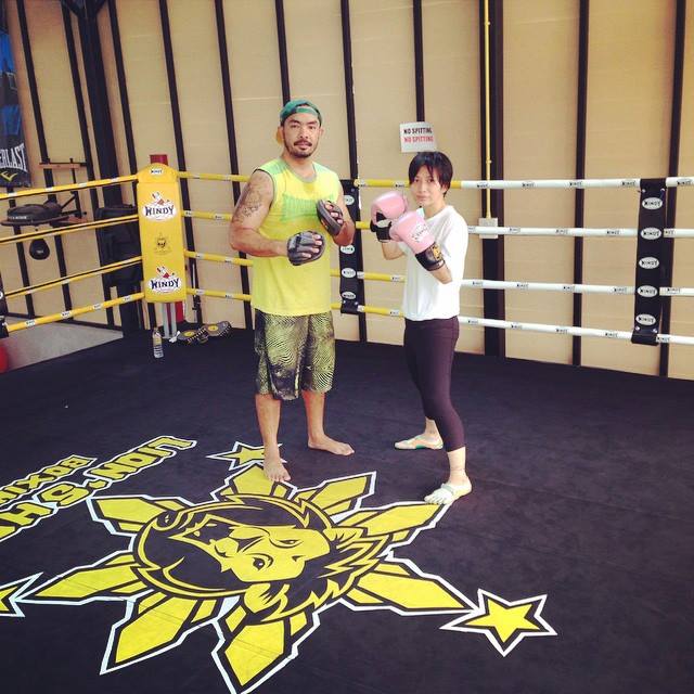 JR Crisologo and student on the ring at lion's head boxing gym