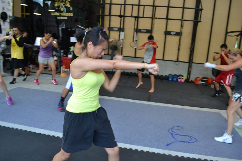 student practicing cross punch at lion's head boxing gym