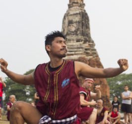 athlete performing wai kru at Ayutthaya temple for muay boran event
