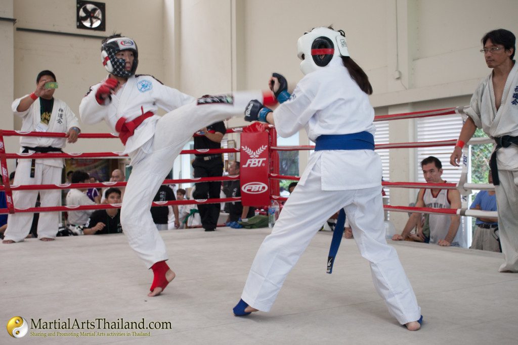 flying kick female fighters on ring