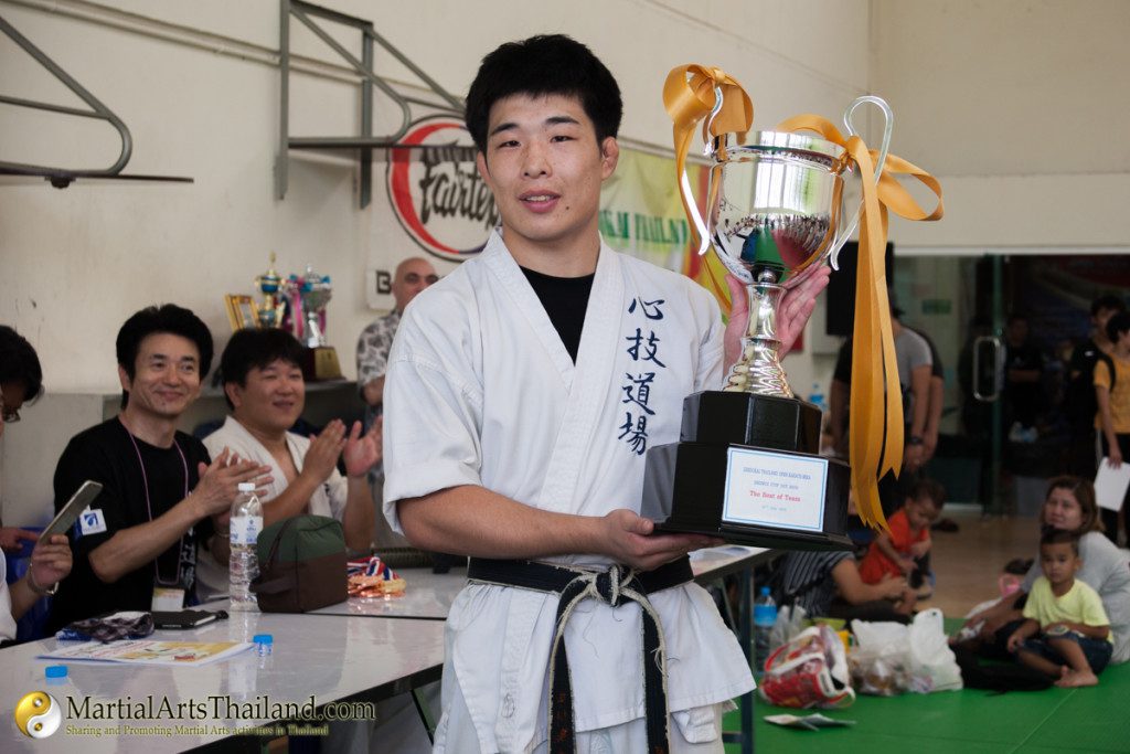 winner shingi cup zendokai holding cup prize