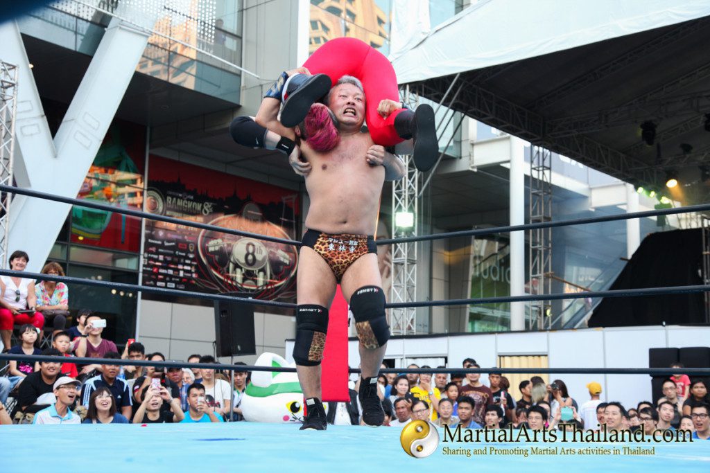 fighter holding opponent on his shoulder while walking around the ring at Pro-Wrestling Japan Expo 2016 Bangkok