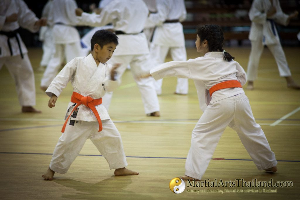 kids practicing karate during kumite