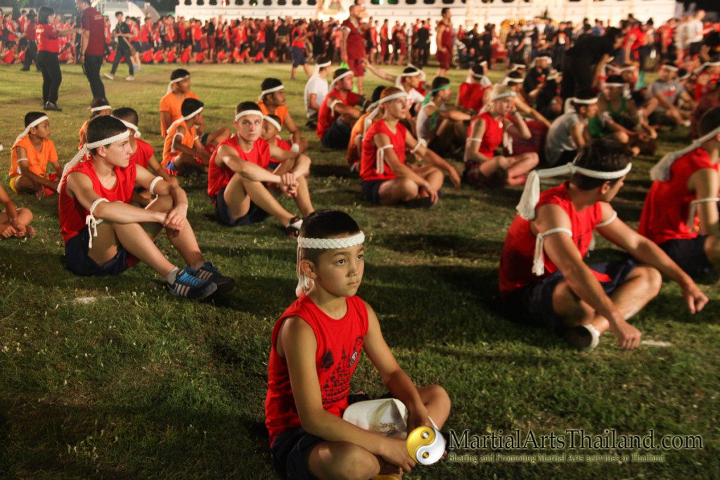 people sitting on field at the 12th Wai Kru Muay Thai Ceremony 2016