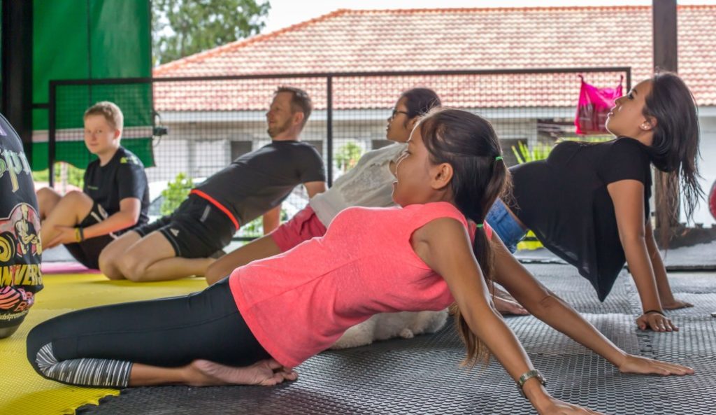 Yoga stretching class at Tree Roots Retreat Rayo