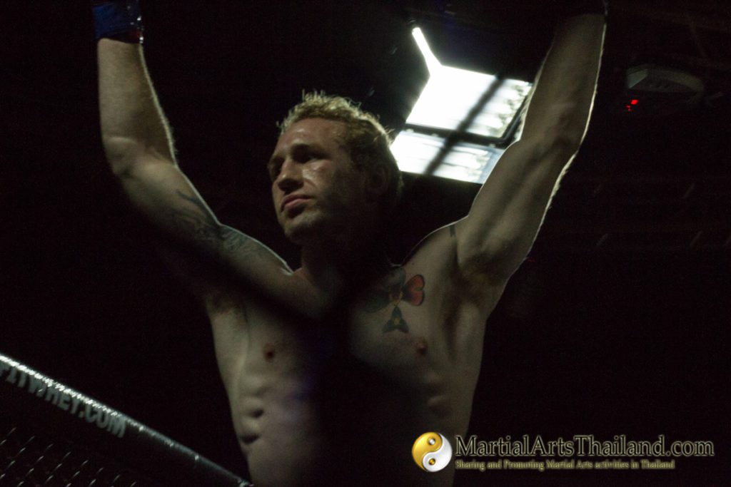 tommy hayden raise hands in victory at Full Metal Dojo 13 Concrete Jungle