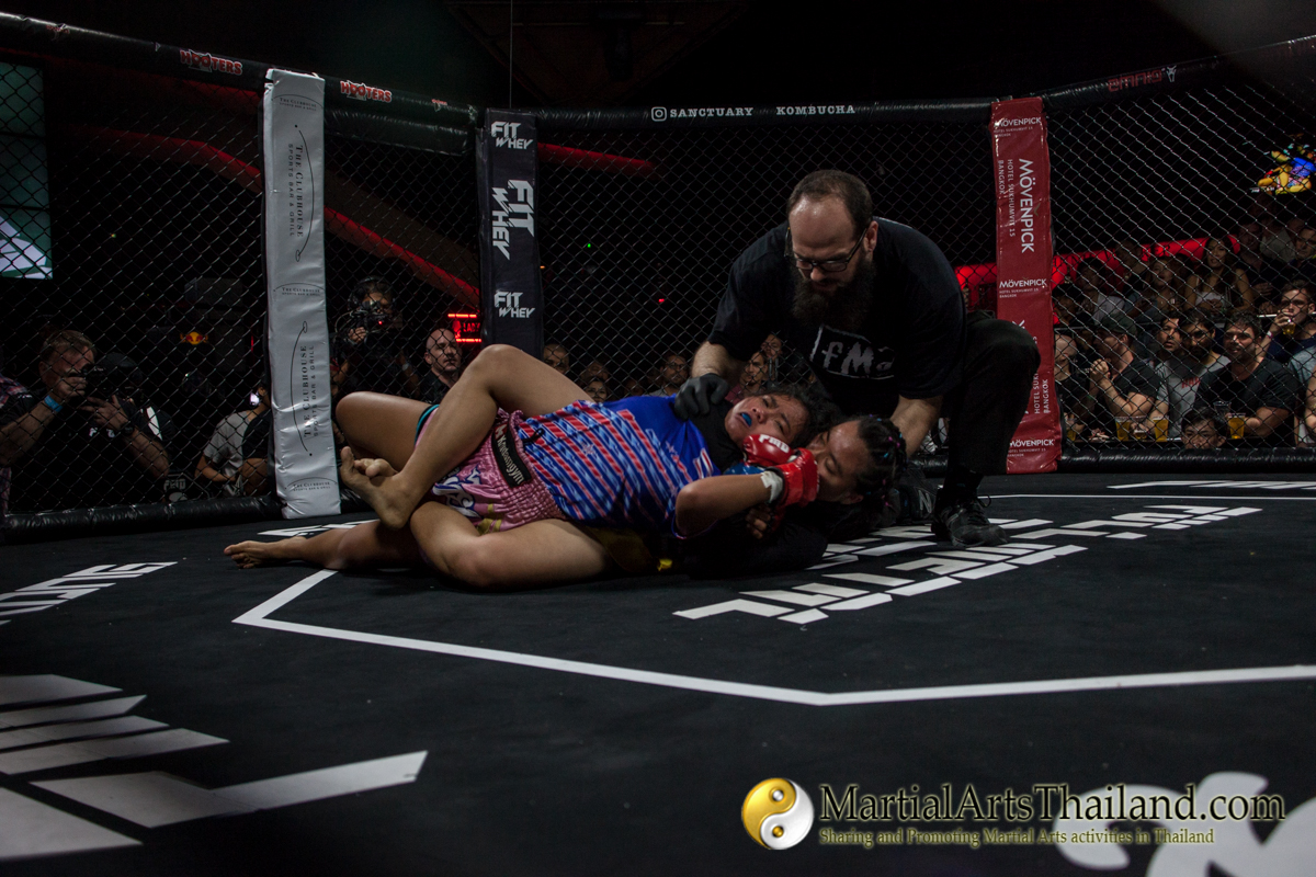 Dana Blouin stopping the fight on the ground at Full Metal Dojo 13