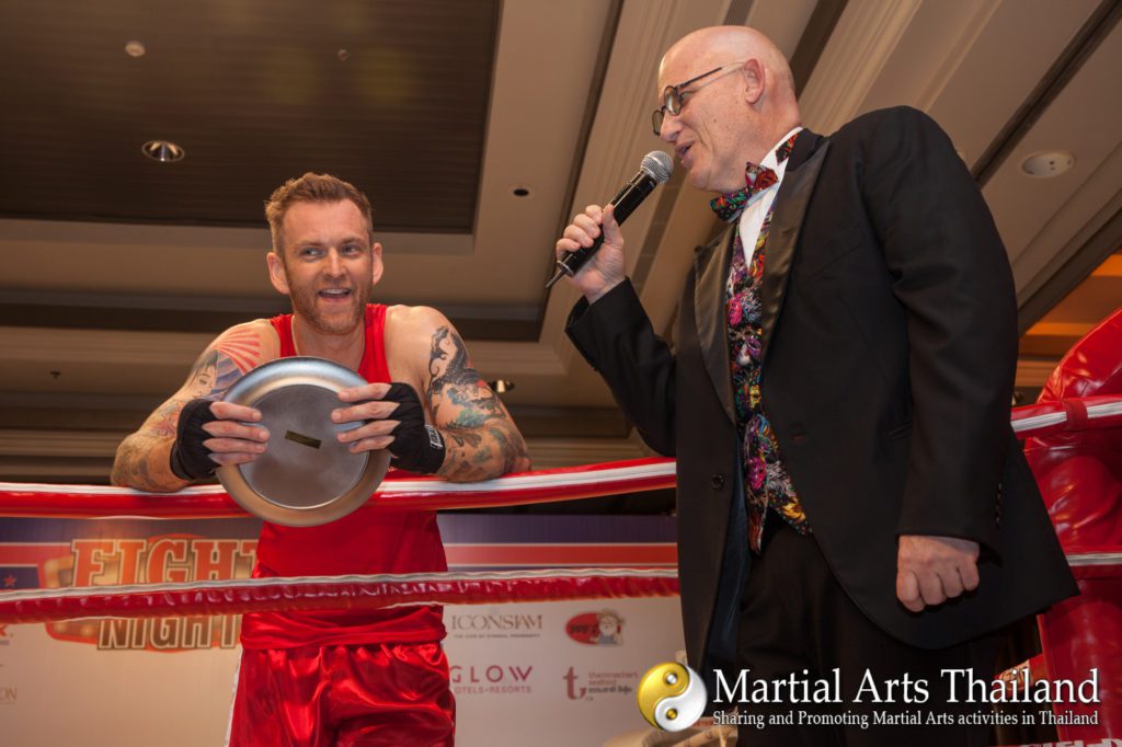 announcer  on ring with fighter winner at Operation Smile Fight Night 2018