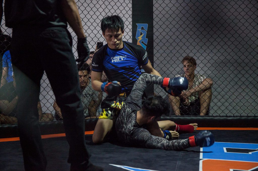 fighters in the cage at NEO Fight 2019 MMA 