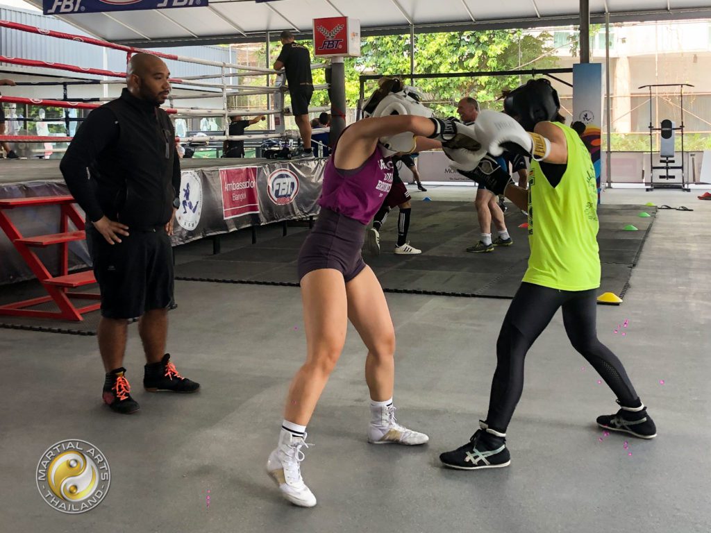 Coach following a couple of boxers at the Free Open Sparring Day Event at The Box Thailand on Feb. 28, 2021