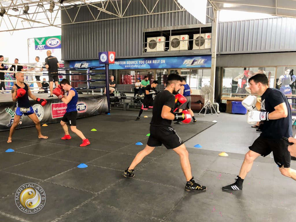 Overview of the Gym with 3 couples of boxers sparring at The Box Thailand open sparring day event