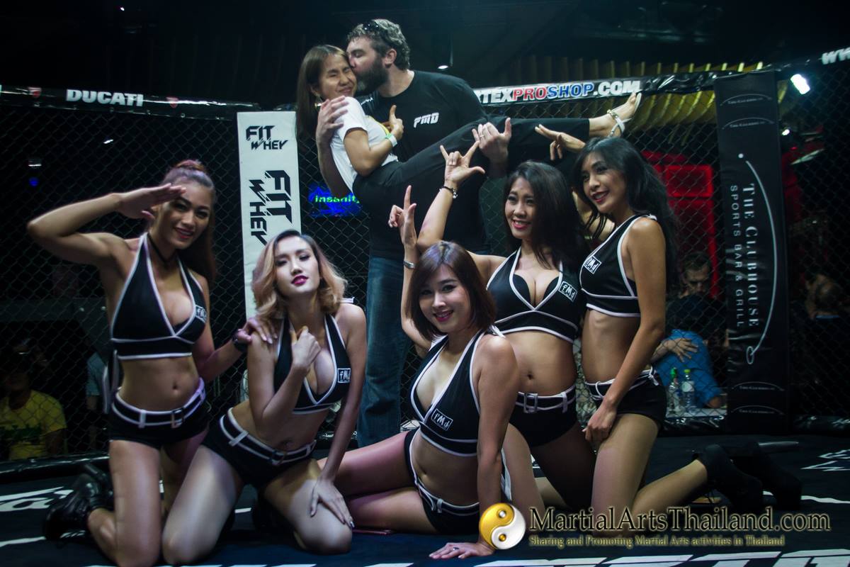 FMD ring girls and Jon Nutt posing after the show inside the cage
