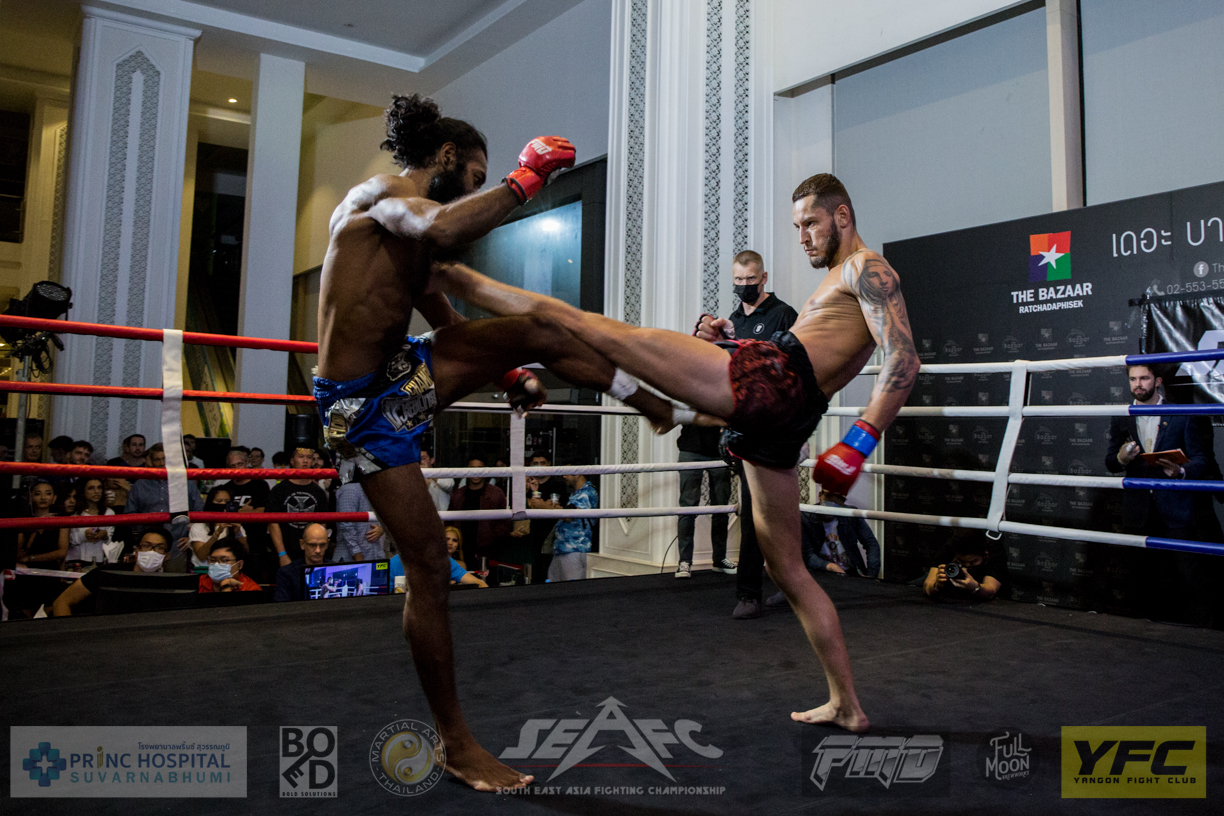 Charled Mainier throwing a long front kick to Alex Singh during their Full Metal Muay Thai fight