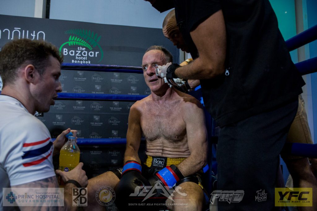 Jack Kneeland during a break with Paul Windsor during his boxing fight vs Seigo Nishida