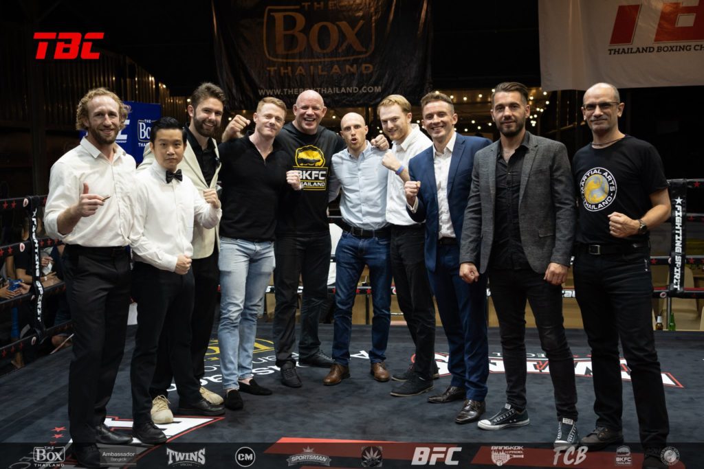 TBC group picture on the ring with Tommy Hayden, Luke Rockwell, Mark Abbott, Nick Chapman, Ali McOnie, Jimmy Bowe, Paul Windsor, Paolo Vettore